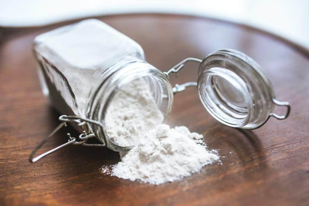 A jar of flour laid down on the table