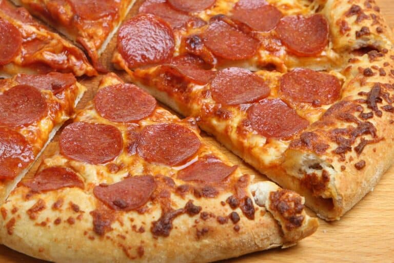 Pepperoni pizza on a wooden surface