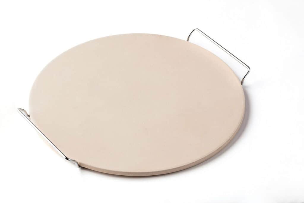 Pizza stone with metal handles on a white background