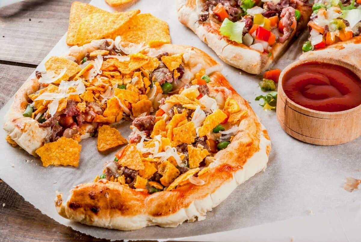 Served slices of taco pizza