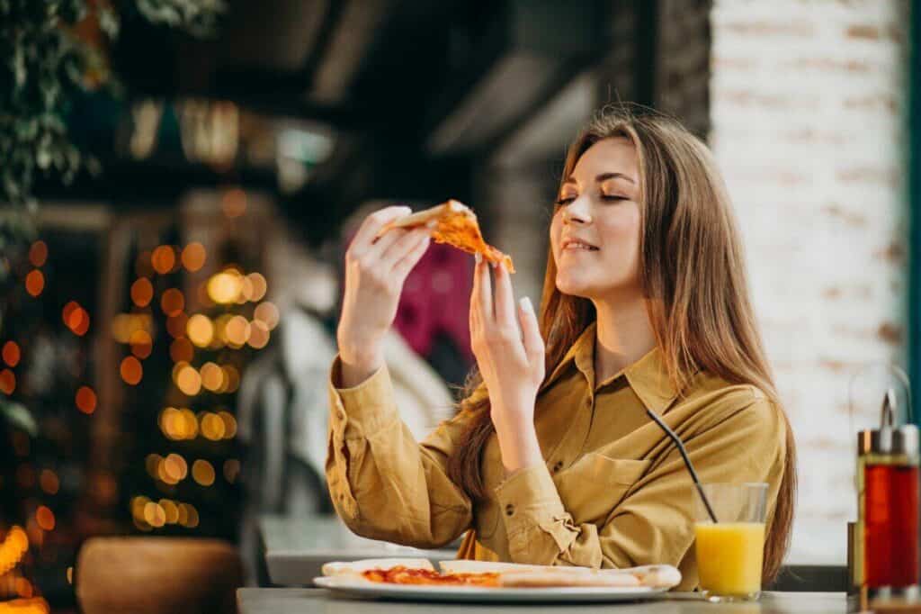 Woman eating a pizza