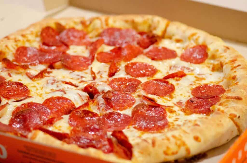 A pepperoni pizza in a box