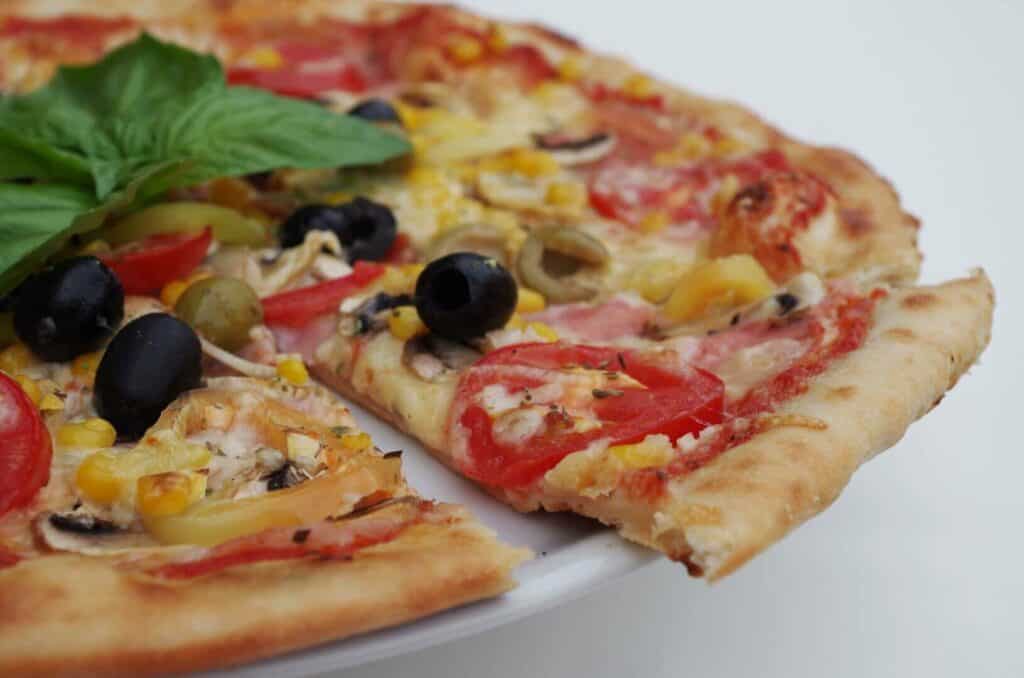 Pizza slice with olives
