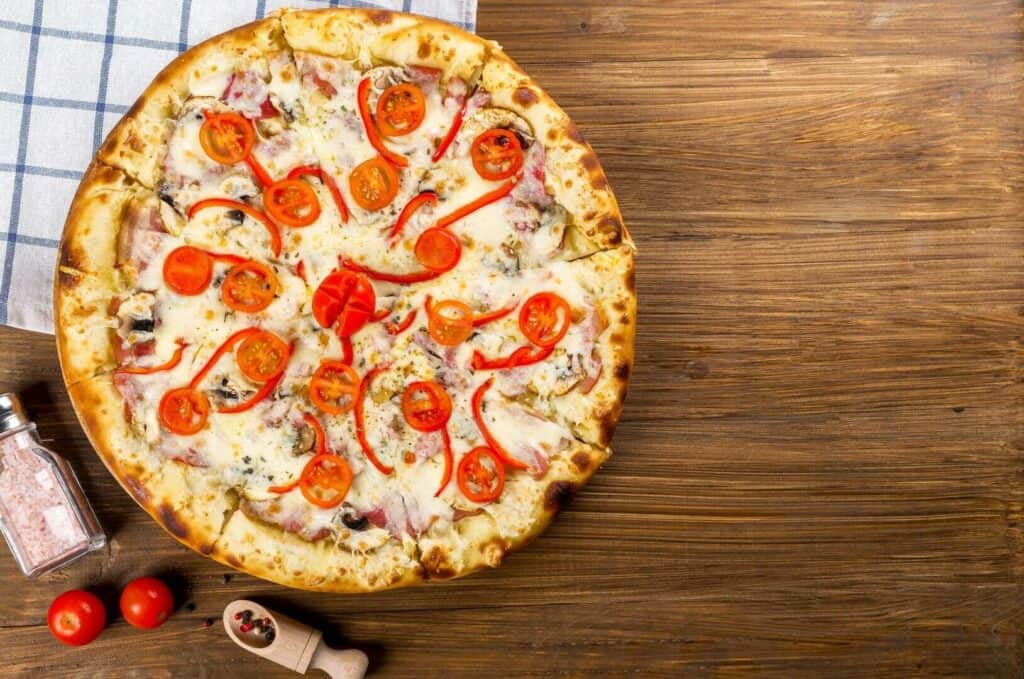 Pizza with tomato and bell peppers